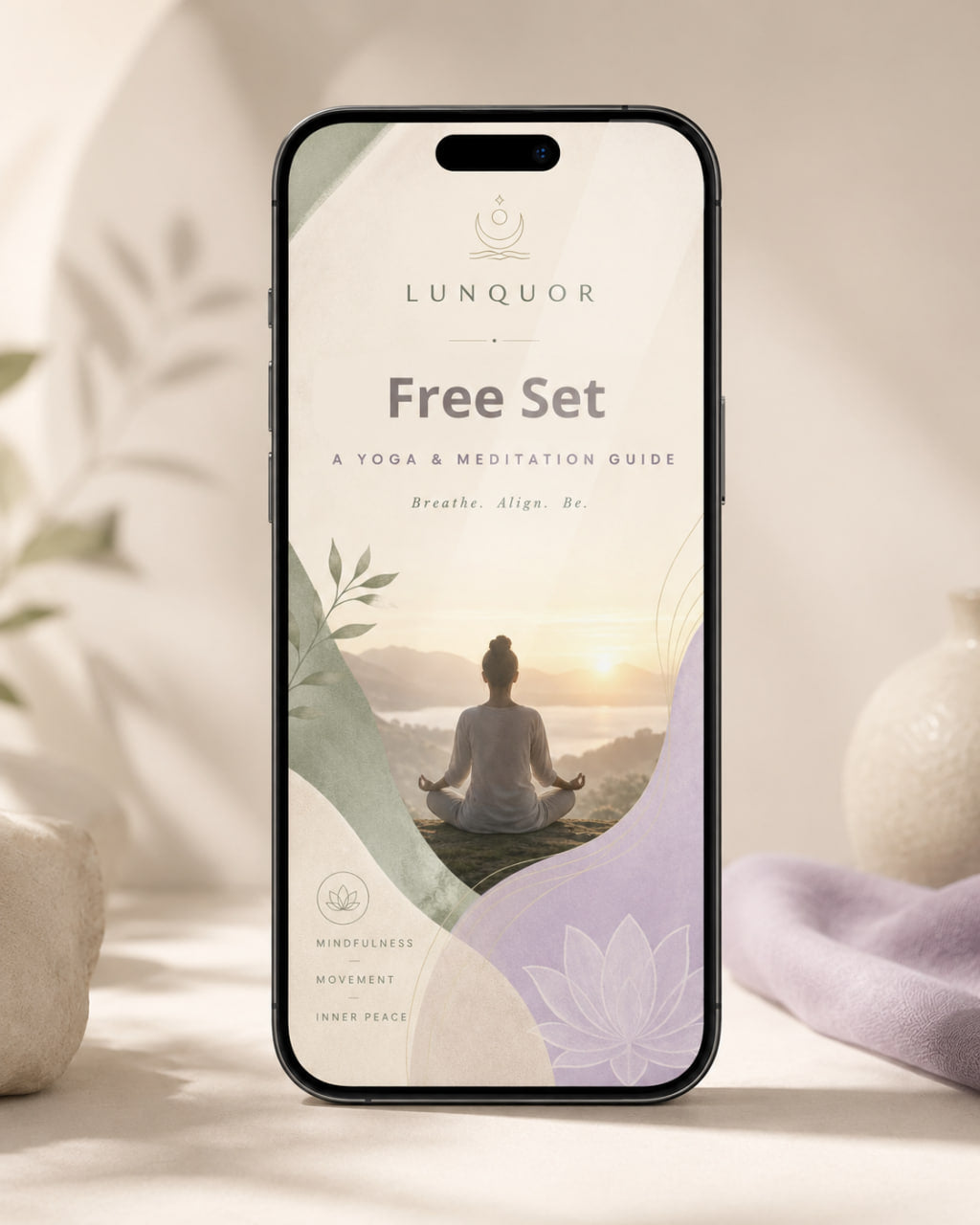 Phone displaying a yoga and meditation app interface with a person in lotus position on a scenic background.